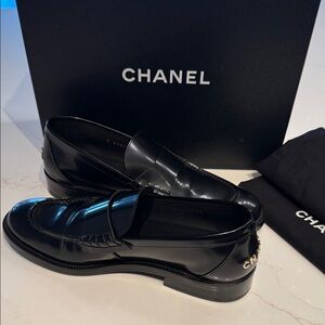 CHANEL Women’s Glossy Black Slip-On Loafers